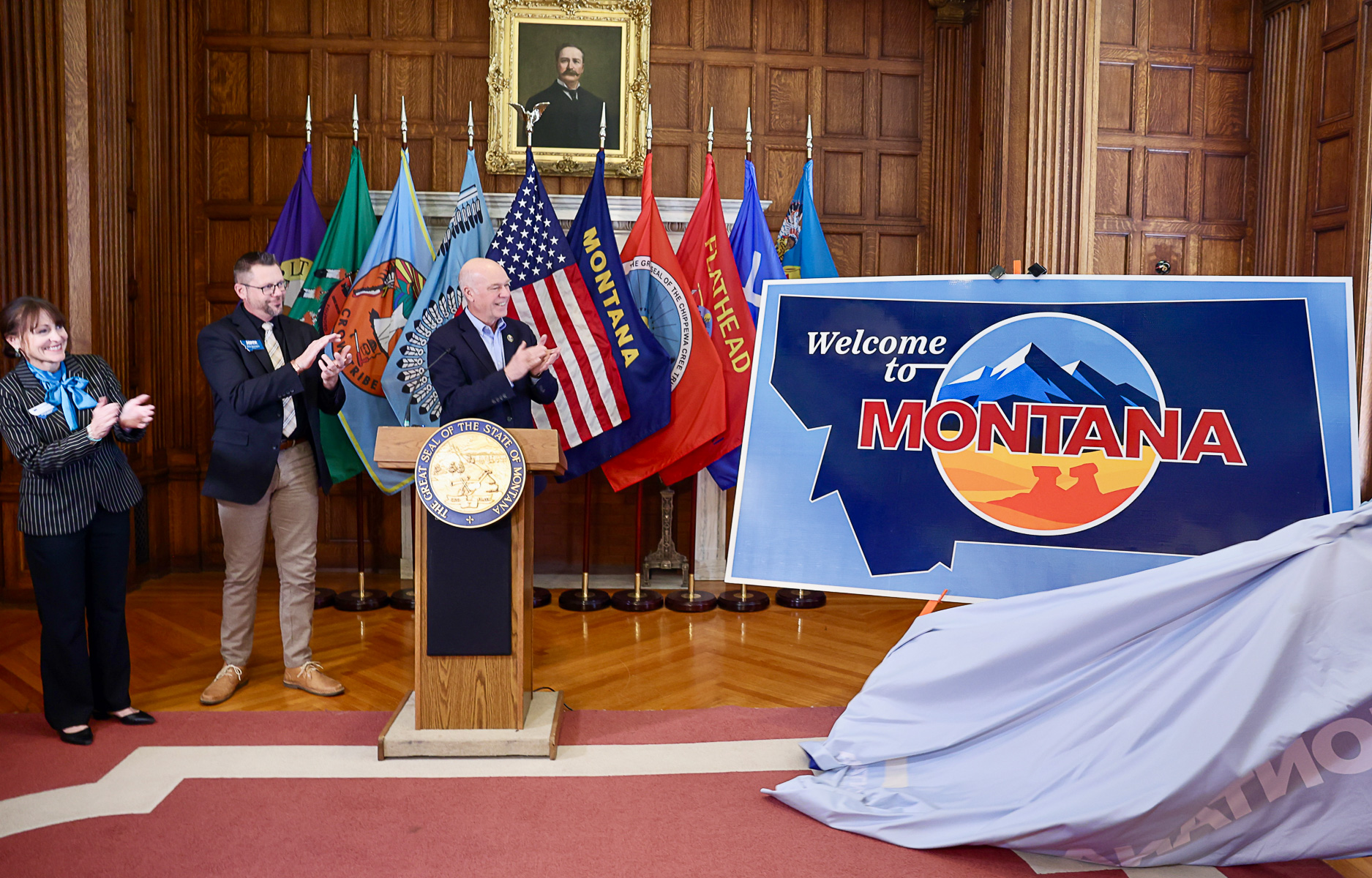 Gov. Gianforte (right), Dir. Dorrington (middle), and Dir. Bertoglio (left) unveiling Montana’s new highway welcome signs